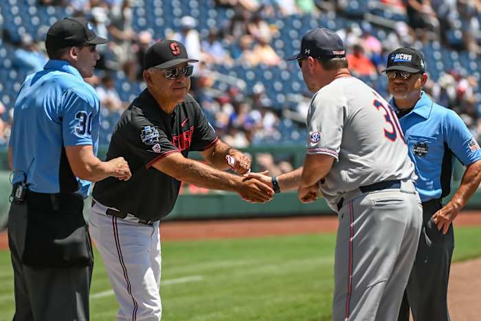 Stanford Cardinal head coach David Esquer and Auburn Tigers head coach Butch Thompson meet before the game at Charles Schwab Field.